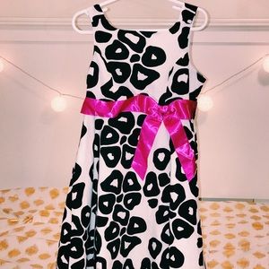 Girls Leopard print dress with pink bow.